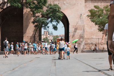 People walking on street in city