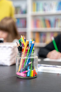 Cropped hand of woman painting