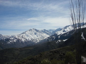 Scenic view of snowcapped mountains against sky