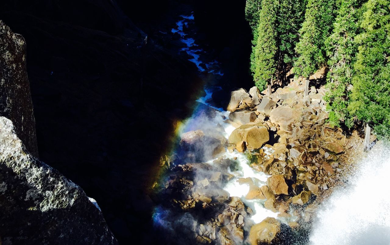 water, rock - object, nature, waterfall, rock formation, beauty in nature, tree, flowing water, motion, reflection, cave, high angle view, tranquility, scenics, no people, day, outdoors, long exposure, sunlight, rock