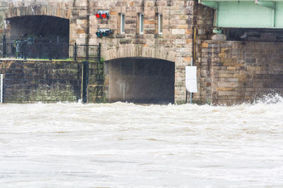 River by building on rainy day