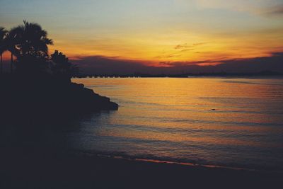 Scenic view of sea at sunset