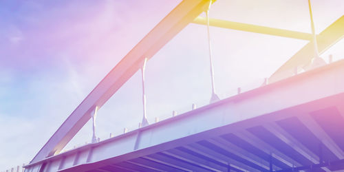 Low angle view of bridge against sky during sunset