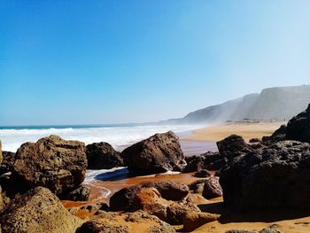 Scenic view of sea against clear sky