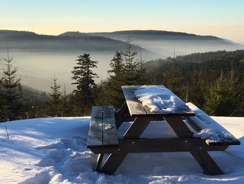 Scenic view of snow covered mountains against sky