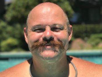 Close-up portrait of man in swimming pool