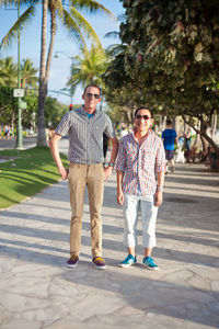 Portrait of young couple standing in park