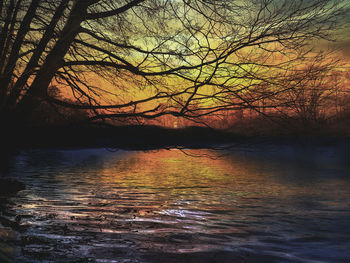 Scenic view of lake against sky during sunset