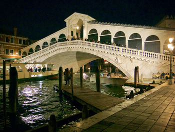 Group of people in front of building at night