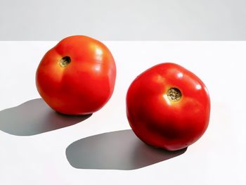 Close-up of tomatoes against white background