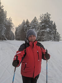 Portrait of man skiing on snow