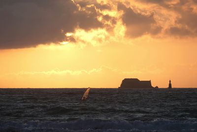 Scenic view of sea against sky during sunset