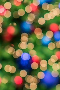 Abstract blurred lights on background in blue, purple, orange colors.  christmas celebration concept