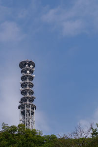 Low angle view of tower against cloudy sky