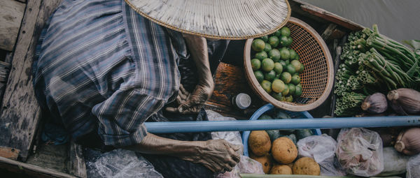 Cropped man selling vegetables