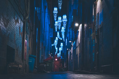 Low angle view of illuminated buildings in city at night