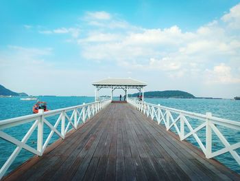 Pier over sea against sky