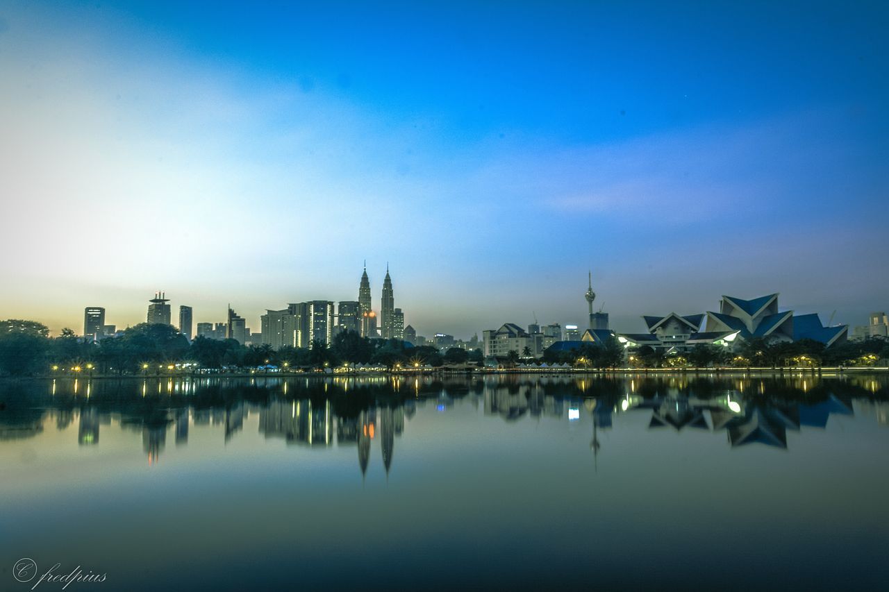 VIEW OF ILLUMINATED CITY AT NIGHT