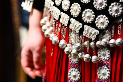 Close-up of person standing on metallic structure