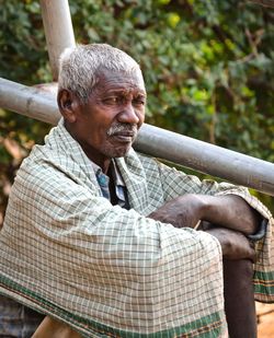 Portrait of man sitting outdoors