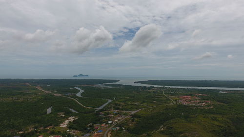 High angle view of road by sea against sky