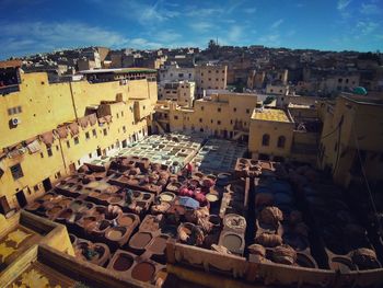 High angle view of buildings in town against sky