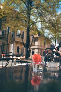 Close-up of water cup on a table at an outdoor restaurant