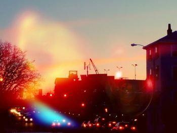 Buildings against sky at sunset