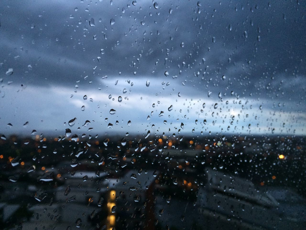 RAIN DROPS ON GLASS WINDOW
