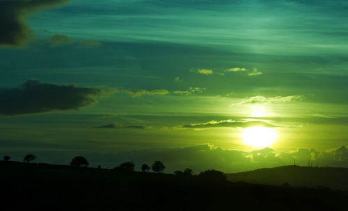 Scenic view of silhouette landscape against sky during sunset