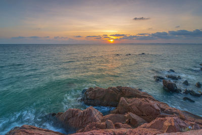 Scenic view of sea against sky during sunset