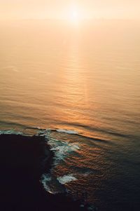 Scenic view of sea at sunset