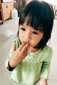 Portrait of cute girl at home