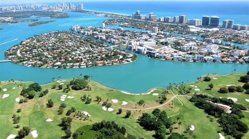 High angle view of city by sea and buildings