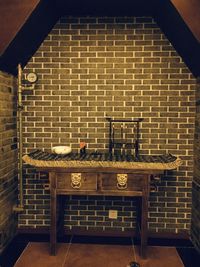 Empty chairs and table against wall at home