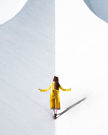 Full length of mid adult woman standing outdoors