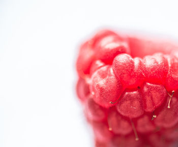 Close-up of strawberry over white background