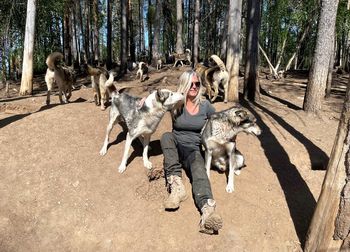 Women with dogs in forest