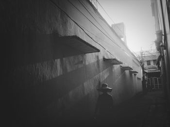 Woman standing in front of building