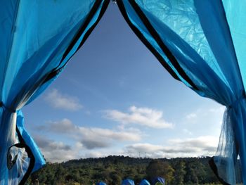 View of tent against cloudy sky