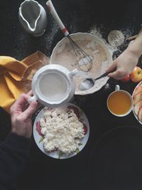 Midsection of man preparing food on table