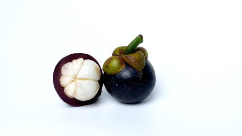 Close-up of fruits against white background