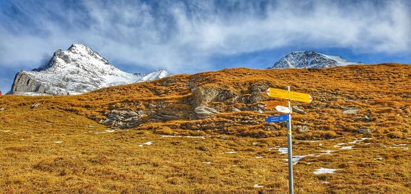 Scenic view of snowcapped mountains against sky
