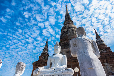 Low angle view of statue of building against sky