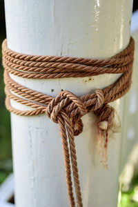 Close-up of rope tied on pole