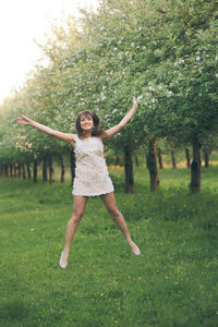 Full length of a smiling young woman in park