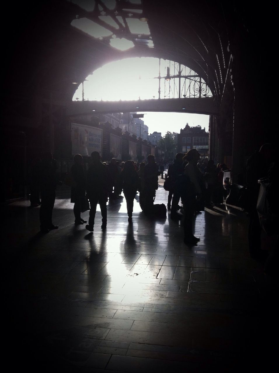 large group of people, architecture, men, built structure, walking, building exterior, person, city life, city, street, lifestyles, silhouette, leisure activity, mixed age range, indoors, full length, medium group of people, group of people, city street