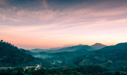 Scenic view of mountains against sky during sunset