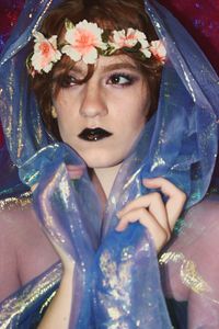 Close-up of beautiful woman wearing flowers