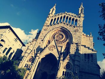 Low angle view of cathedral against blue sky